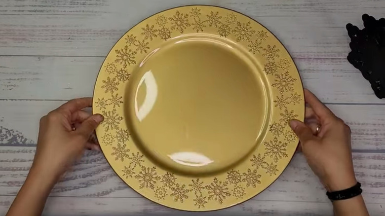 Dollar Tree's round gold snowflake charger