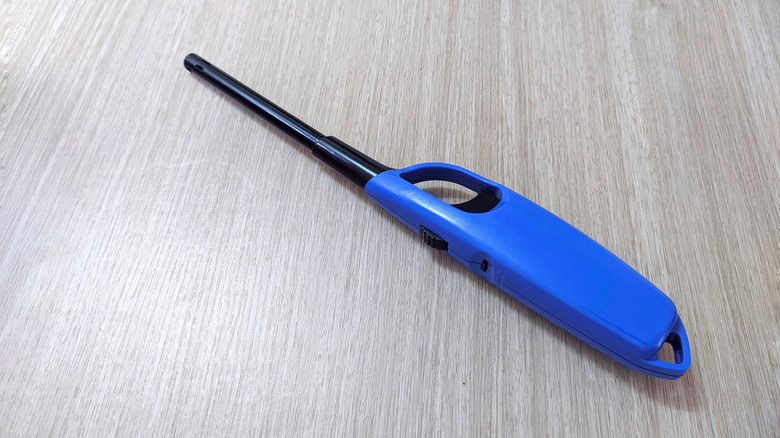 Blue candle lighter on a table