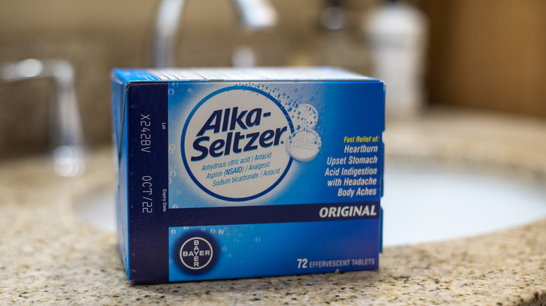 A blue Alka-Seltzer box sitting on a kitchen counter