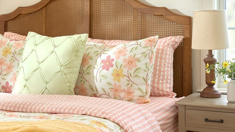 Dollar General Kathy Ireland peach and white queen bed sheet set on made bed