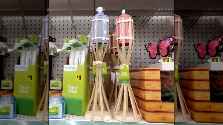 Dollar General Bamboo Table Torch in lavender and pink on the shelf in store