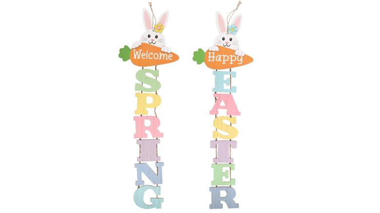 Two vertical wooden wall signs say Happy Easter and Welcome Spring.