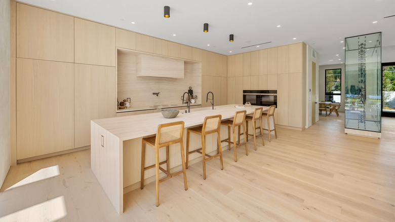 kitchen with white oak cabinets, floors, and chairs