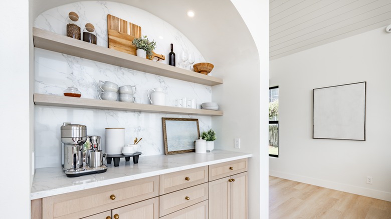 a modern kitchen coffee bar in an arched recess
