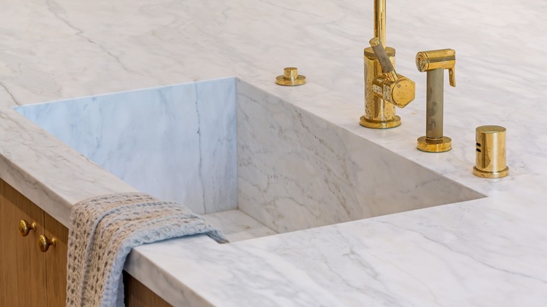a stone kitchen sink integrated into the countertop