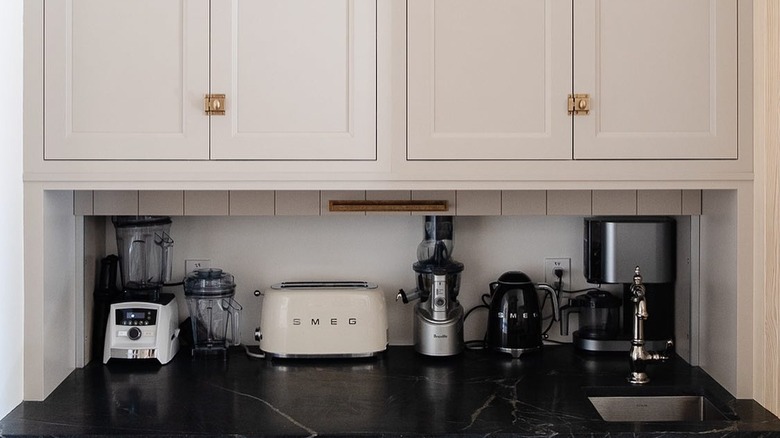 an appliance garage behind a movable backsplash