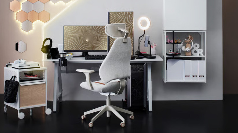 A large GRUPPSPEL gaming chair from IKEA sits in front of a modern office setup