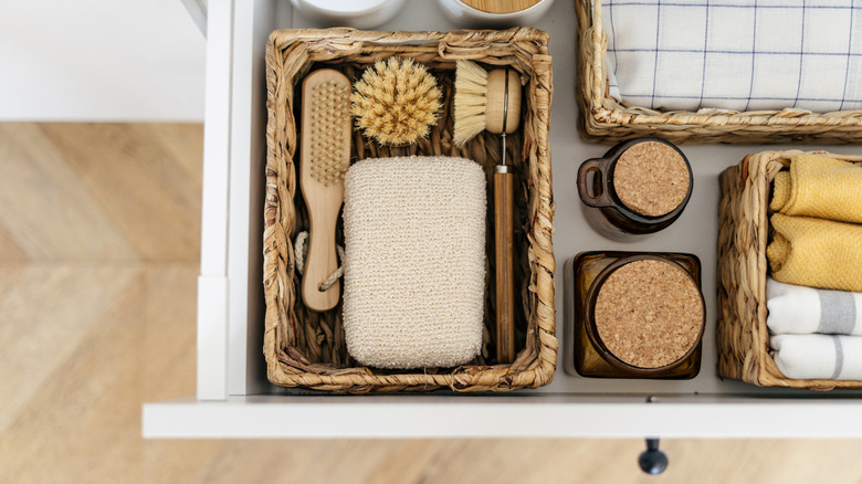Kitchen drawer open with woven basket organizers