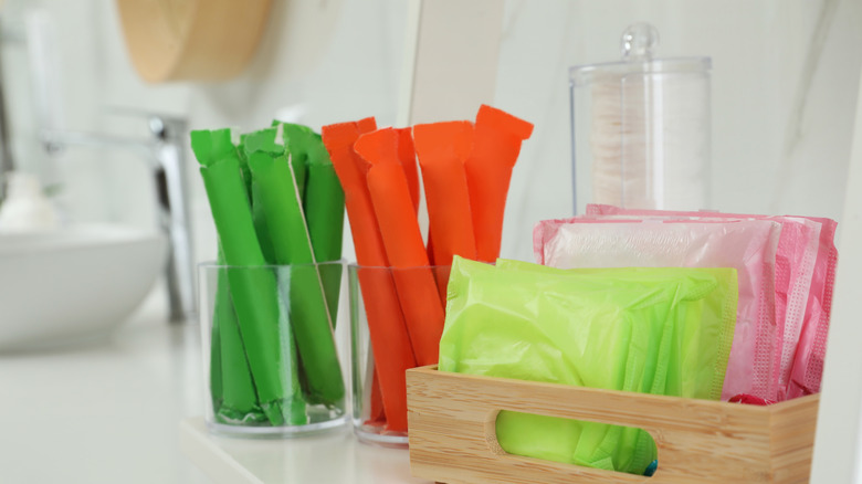 Feminine hygiene products on a bathroom counter