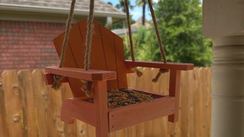 Belavi Picnic Table Bird Feeder hanging on a patio