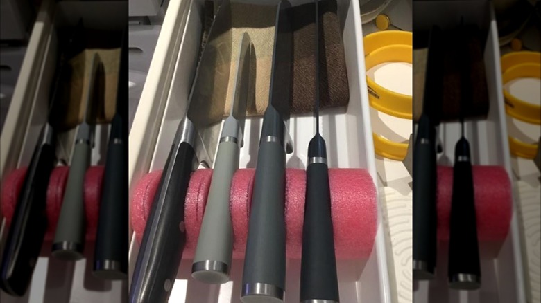 Kitchen knives organized in drawer using pool noodle.