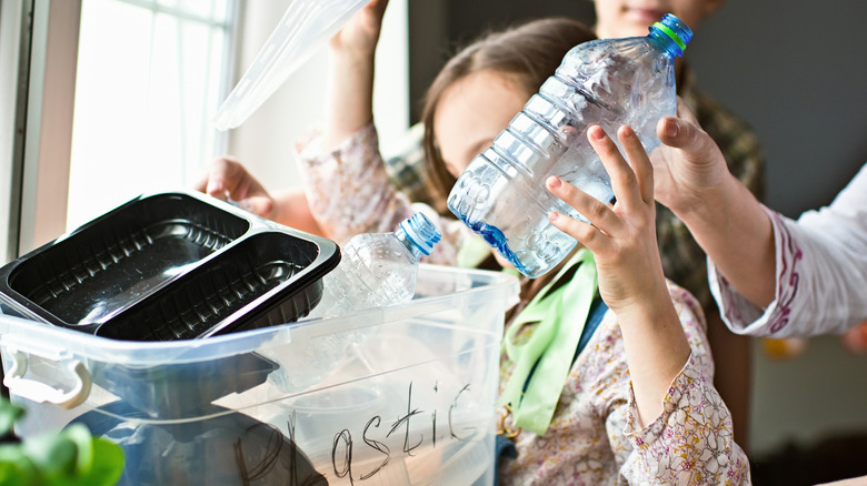 Kids putting away recyling