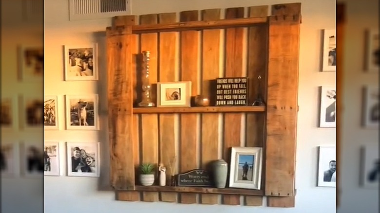 Cozy warm wood living room shelf with family photos and knick-knacks