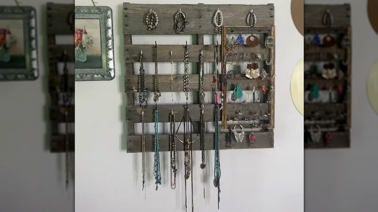 Gray wood jewelery display made of repurposed wood pallet with western jewelry