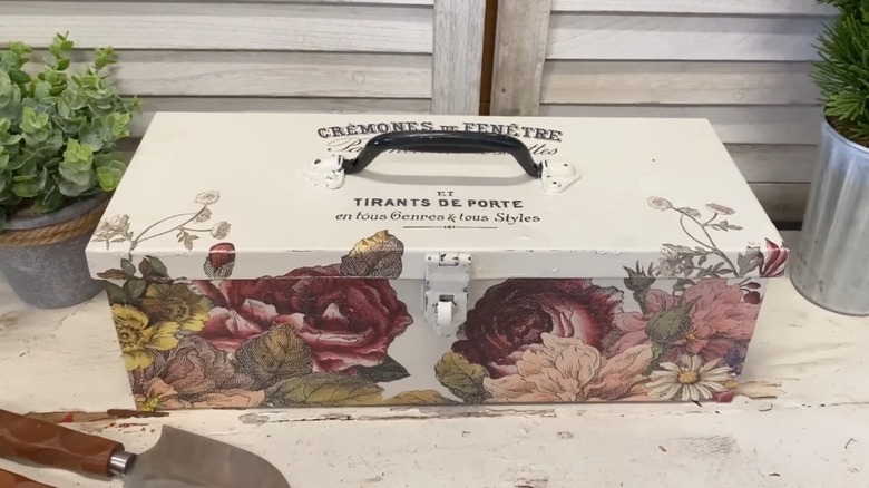Toolbox covered with floral design stickers