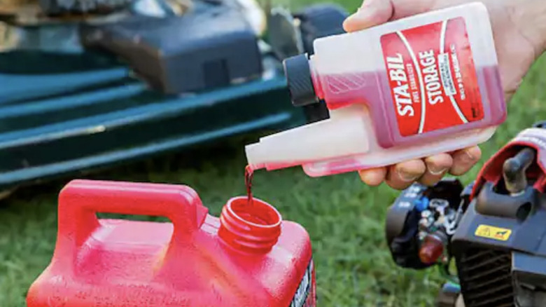 Man using fuel stabilizer in his gas canister