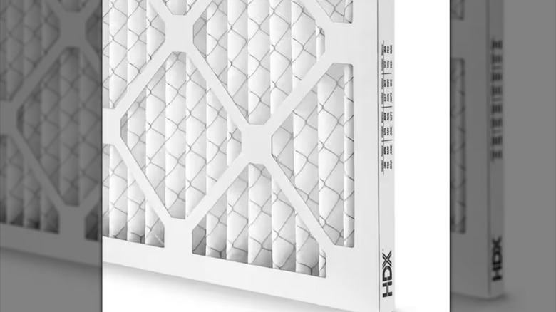 A top-rated HDX Superior Pleated Air Filter from Home Depot is shown in a detail shot