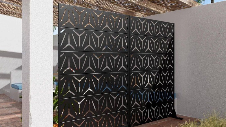 Dovelina two-piece metal garden privacy screens set up outside