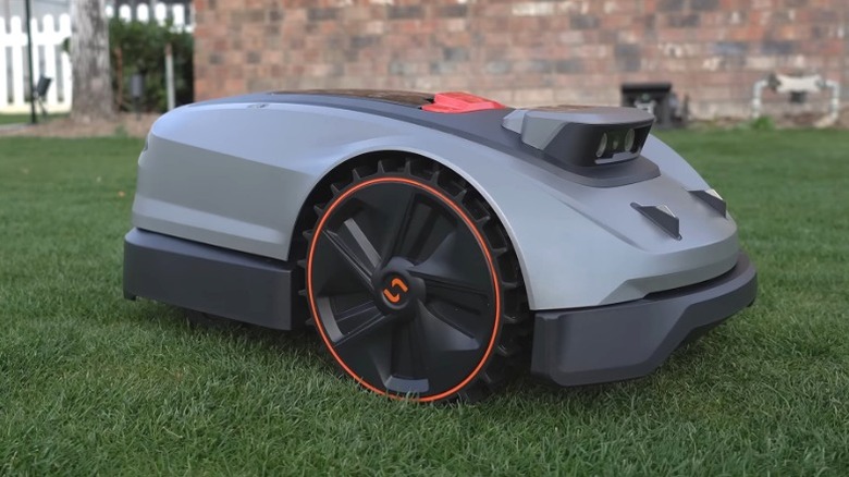 A Sunseeker X3 Plus robot lawn mower on a freshly cut lawn