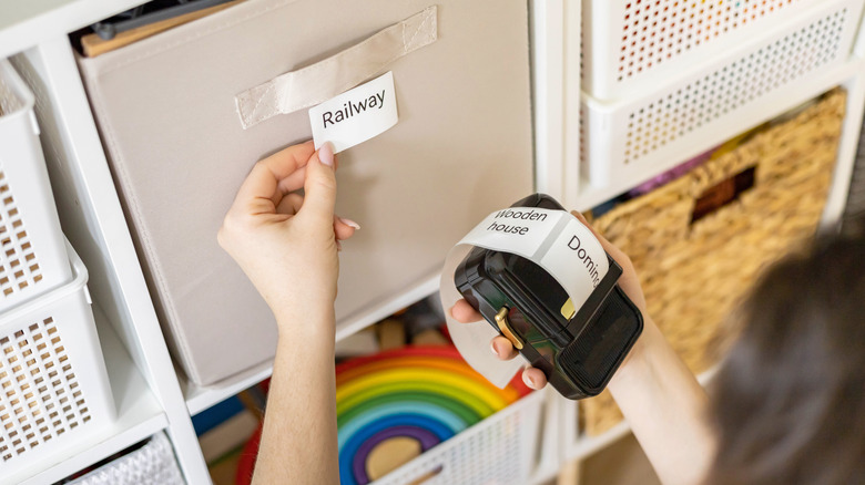 Person using label maker to get organized