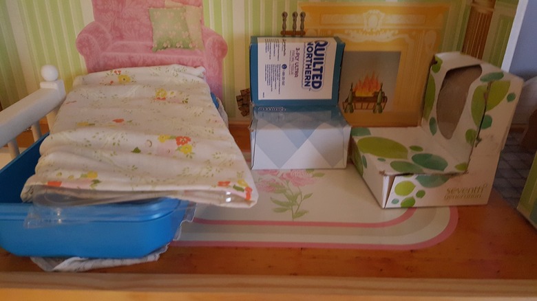 Swiffer container wrapped in fabric for Barbie dolls in homemade dollhouse