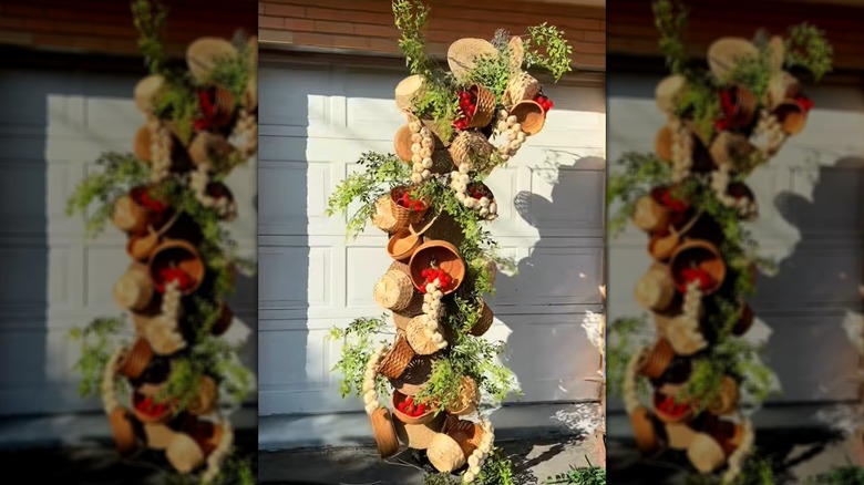 Farmhouse-style arch made with baskets and greenery