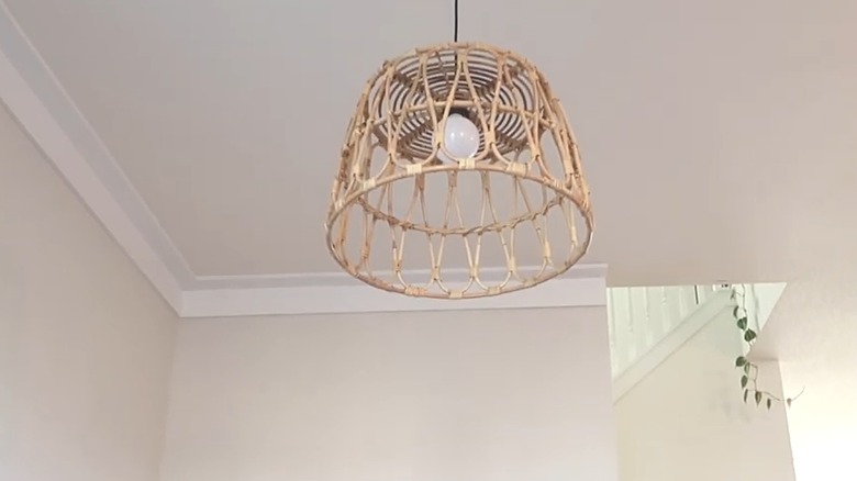 Hanging boho pendant light made from open weave basket