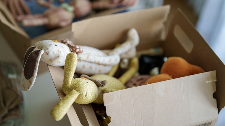 Stuffed bunnies in a cardboard box
