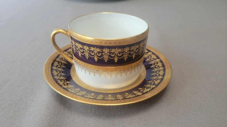 A teacup and saucer with the Chenoceaux Cobalt pattern from Bernardaud