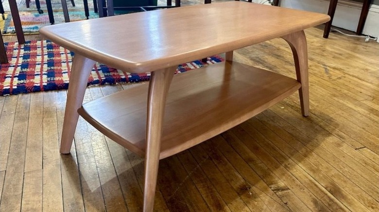 Heywood Wakefield coffee table sitting on wood floors