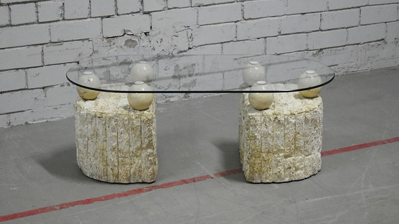 Magnussen Ponte Coffee Table sitting on a concrete floor