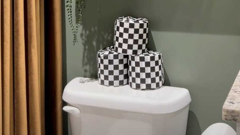 Toilet paper wrapped in checkered tissue paper