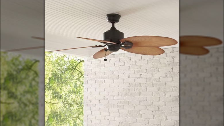 Hampton Bay ceiling fan installed on a porch ceiling outdoors