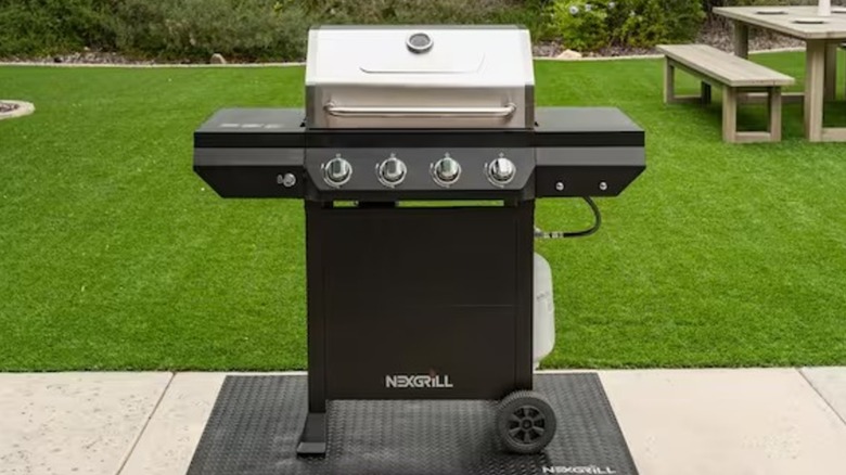 Nexgrill sale grill sitting on a grilling pad on a concrete patio