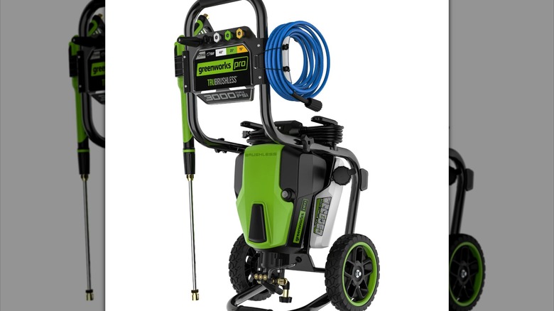Greenworks pressure washer with a blue hose