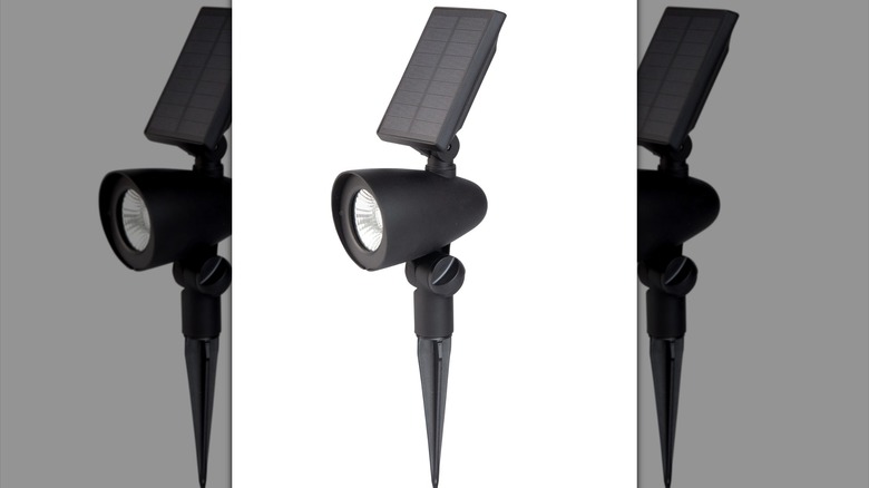 Black LED spotlight with solar panel