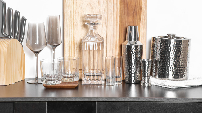 A bar with cocktail mixing and serving items