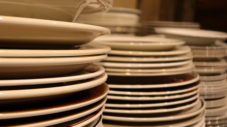Plates stacked up in a thrift store