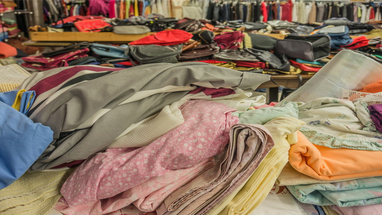 Fabrics laid out on a table at a secondhand store