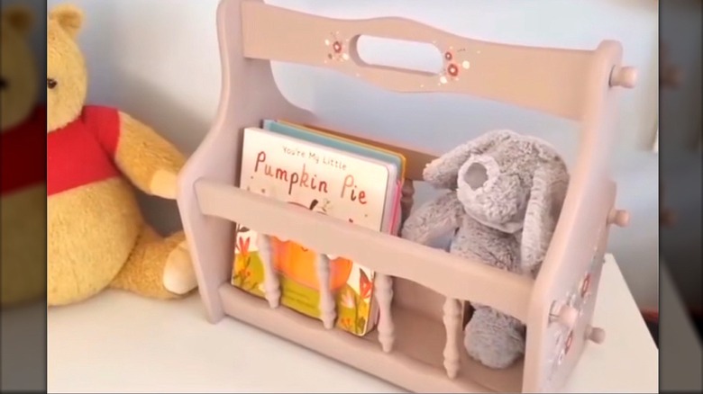 Stuffed plushies and nursery books in DIY nursery box