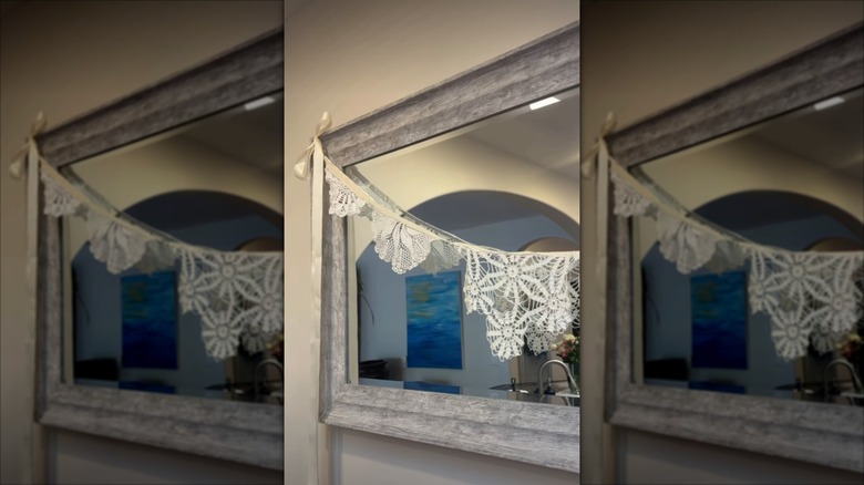 A garland of doilies hung on a wall