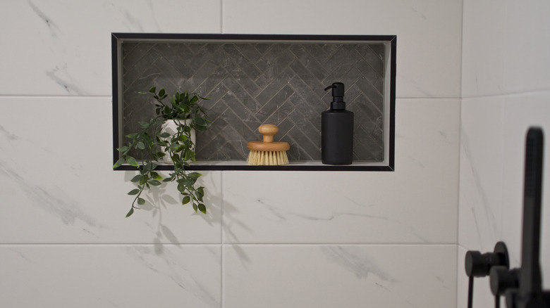 Shower niches outlined in black schluter strips