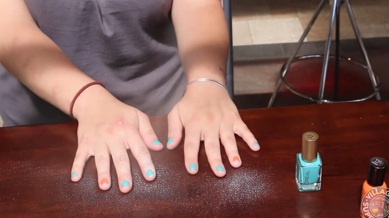 Applying cooking spray to wet nail polish