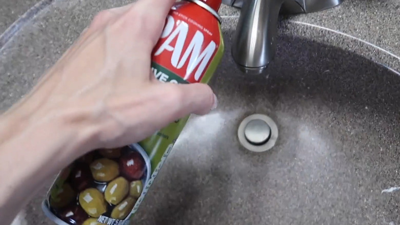 Cleaning a bathroom sink with Pam cooking spray