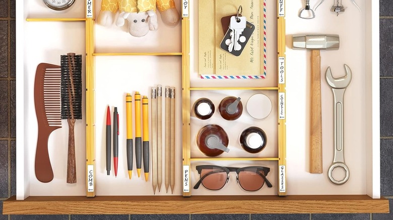 SpaceAid Bamboo Drawer Dividers in a drawer keeping tools organized