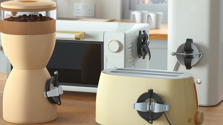 Kitchen appliances with their cords tied neatly around cord organizers