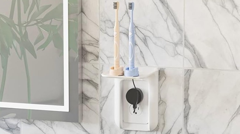 Electric toothbrushes on the shelf of a wall extender