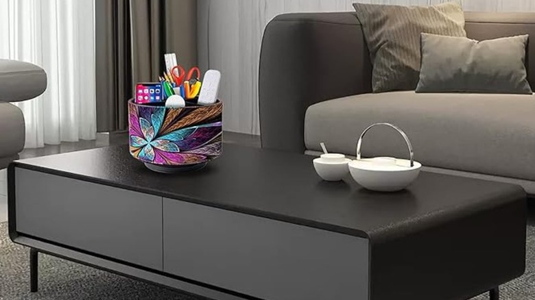 A colorful remote organizer on a coffee table in a living room