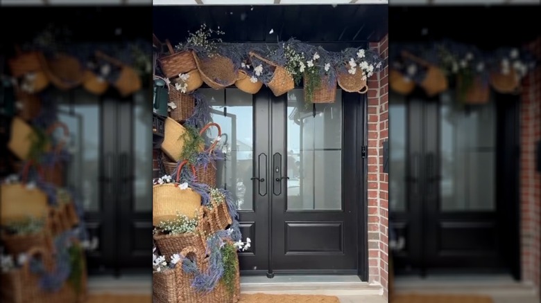 Large double front doors with DIY basket and artificial foliage arch