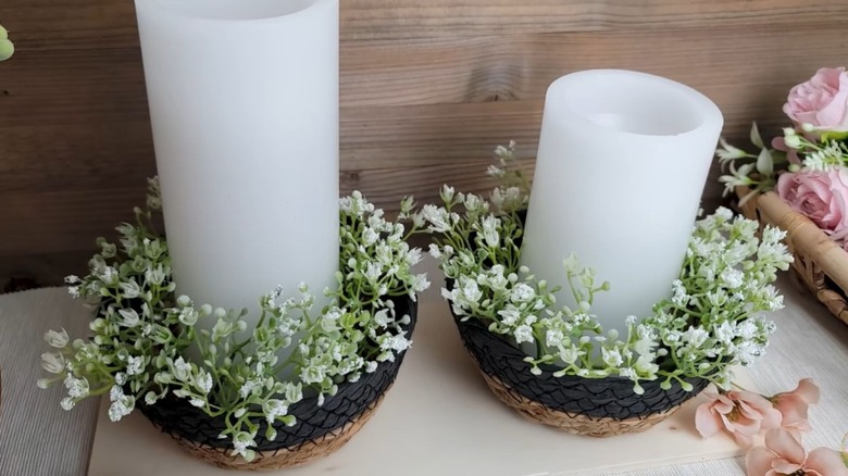 candles and faix flowers placed in two Birch and Vine woven baskets